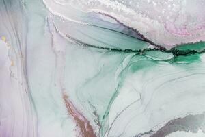 Painting created with alcohol ink. Soft smooth color transitions combined with clear gold and silver edges. Blue, pink, green abstract color combination. photo