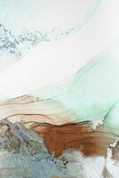 Painting created with alcohol ink. Soft smooth color transitions combined with clear gold and silver edges. Blue, pink, green abstract color combination. photo