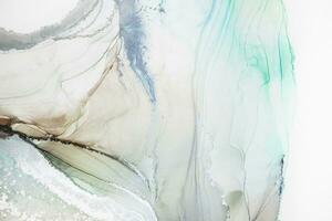 Painting created with alcohol ink. Soft smooth color transitions combined with clear gold and silver edges. Blue, pink, green abstract color combination. photo
