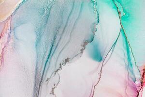 Painting created with alcohol ink. Soft smooth color transitions combined with clear gold and silver edges. Blue, pink, green abstract color combination. photo