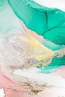 Painting created with alcohol ink. Soft smooth color transitions combined with clear gold and silver edges. Blue, pink, green abstract color combination. photo