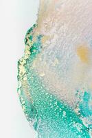Painting created with alcohol ink. Soft smooth color transitions combined with clear gold and silver edges. Blue, pink, green abstract color combination. photo