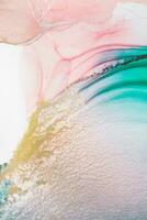 Painting created with alcohol ink. Soft smooth color transitions combined with clear gold and silver edges. Blue, pink, green abstract color combination. photo