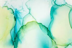Painting created with alcohol ink. Soft smooth color transitions combined with clear gold and silver edges. Blue, pink, green abstract color combination. photo