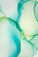 Painting created with alcohol ink. Soft smooth color transitions combined with clear gold and silver edges. Blue, pink, green abstract color combination. photo