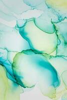 Painting created with alcohol ink. Soft smooth color transitions combined with clear gold and silver edges. Blue, pink, green abstract color combination. photo