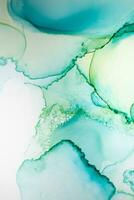 Painting created with alcohol ink. Soft smooth color transitions combined with clear gold and silver edges. Blue, pink, green abstract color combination. photo