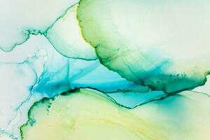 Painting created with alcohol ink. Soft smooth color transitions combined with clear gold and silver edges. Blue, pink, green abstract color combination. photo