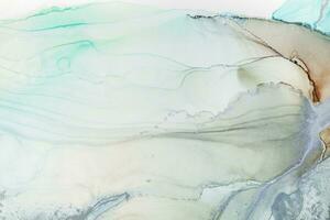 Painting created with alcohol ink. Soft smooth color transitions combined with clear gold and silver edges. Blue, pink, green abstract color combination. photo