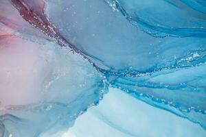 Painting created with alcohol ink. Soft smooth color transitions combined with clear gold and silver edges. Blue, pink, green abstract color combination. photo