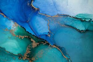 Painting created with alcohol ink. Soft smooth color transitions combined with clear gold and silver edges. Blue, pink, green abstract color combination. photo