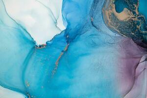 Painting created with alcohol ink. Soft smooth color transitions combined with clear gold and silver edges. Blue, pink, green abstract color combination. photo