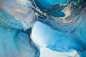 Painting created with alcohol ink. Soft smooth color transitions combined with clear gold and silver edges. Blue, pink, green abstract color combination. photo