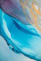 Painting created with alcohol ink. Soft smooth color transitions combined with clear gold and silver edges. Blue, pink, green abstract color combination. photo