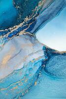 Painting created with alcohol ink. Soft smooth color transitions combined with clear gold and silver edges. Blue, pink, green abstract color combination. photo