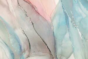 Painting created with alcohol ink. Soft smooth color transitions combined with clear gold and silver edges. Blue, pink, green abstract color combination. photo