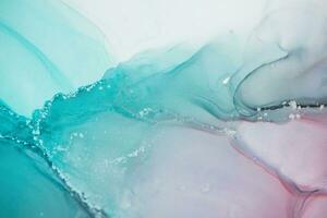 Painting created with alcohol ink. Soft smooth color transitions combined with clear gold and silver edges. Blue, pink, green abstract color combination. photo