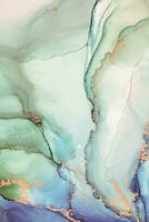 Painting created with alcohol ink. Soft smooth color transitions combined with clear gold and silver edges. Blue, pink, green abstract color combination. photo