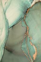 Painting created with alcohol ink. Soft smooth color transitions combined with clear gold and silver edges. Blue, pink, green abstract color combination. photo