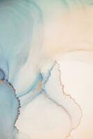 Painting created with alcohol ink. Soft smooth color transitions combined with clear gold and silver edges. Blue, pink, green abstract color combination. photo