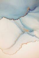 Painting created with alcohol ink. Soft smooth color transitions combined with clear gold and silver edges. Blue, pink, green abstract color combination. photo