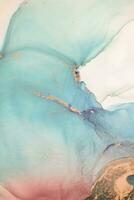 Painting created with alcohol ink. Soft smooth color transitions combined with clear gold and silver edges. Blue, pink, green abstract color combination. photo