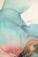 Painting created with alcohol ink. Soft smooth color transitions combined with clear gold and silver edges. Blue, pink, green abstract color combination. photo
