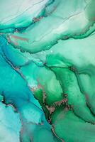 Painting created with alcohol ink. Soft smooth color transitions combined with clear gold and silver edges. Blue, pink, green abstract color combination. photo