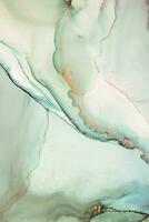 Painting created with alcohol ink. Soft smooth color transitions combined with clear gold and silver edges. Blue, pink, green abstract color combination. photo