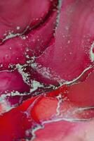 Painting created with alcohol ink. Soft smooth color transitions combined with clear gold and silver edges. Blue, pink, green abstract color combination. photo
