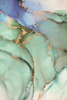Painting created with alcohol ink. Soft smooth color transitions combined with clear gold and silver edges. Blue, pink, green abstract color combination. photo
