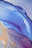 Painting created with alcohol ink. Soft smooth color transitions combined with clear gold and silver edges. Blue, pink, green abstract color combination. photo