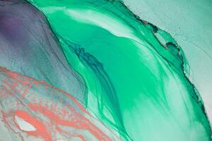 Painting created with alcohol ink. Soft smooth color transitions combined with clear gold and silver edges. Blue, pink, green abstract color combination. photo
