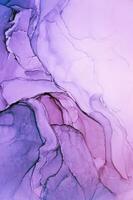 Abstract created using the technique of Alcohol ink. Macro photography of the smallest details of a panting. The panting shows how overflows of shades and colors of paint resemble space motifs. photo
