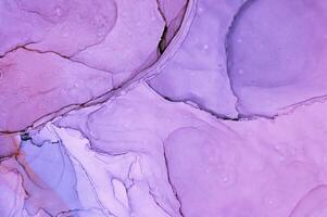 Abstract created using the technique of Alcohol ink. Macro photography of the smallest details of a panting. The panting shows how overflows of shades and colors of paint resemble space motifs. photo