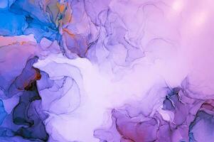 Abstract created using the technique of Alcohol ink. Macro photography of the smallest details of a panting. The panting shows how overflows of shades and colors of paint resemble space motifs. photo
