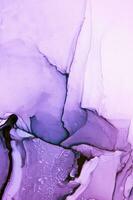 Abstract created using the technique of Alcohol ink. Macro photography of the smallest details of a panting. The panting shows how overflows of shades and colors of paint resemble space motifs. photo