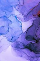 Abstract created using the technique of Alcohol ink. Macro photography of the smallest details of a panting. The panting shows how overflows of shades and colors of paint resemble space motifs. photo