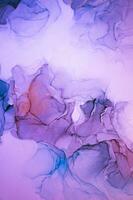 Abstract created using the technique of Alcohol ink. Macro photography of the smallest details of a panting. The panting shows how overflows of shades and colors of paint resemble space motifs. photo