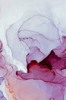 Abstract created using the technique of Alcohol ink. Macro photography of the smallest details of a panting. The panting shows how overflows of shades and colors of paint resemble space motifs. photo