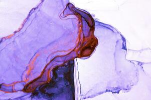 Abstract created using the technique of Alcohol ink. Macro photography of the smallest details of a panting. The panting shows how overflows of shades and colors of paint resemble space motifs. photo
