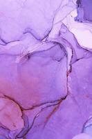 Abstract created using the technique of Alcohol ink. Macro photography of the smallest details of a panting. The panting shows how overflows of shades and colors of paint resemble space motifs. photo