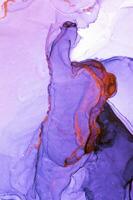 Abstract created using the technique of Alcohol ink. Macro photography of the smallest details of a panting. The panting shows how overflows of shades and colors of paint resemble space motifs. photo