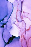 Abstract created using the technique of Alcohol ink. Macro photography of the smallest details of a panting. The panting shows how overflows of shades and colors of paint resemble space motifs. photo