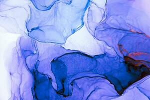 Abstract created using the technique of Alcohol ink. Macro photography of the smallest details of a panting. The panting shows how overflows of shades and colors of paint resemble space motifs. photo