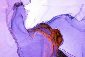 Abstract created using the technique of Alcohol ink. Macro photography of the smallest details of a panting. The panting shows how overflows of shades and colors of paint resemble space motifs. photo