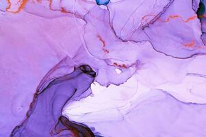 Abstract created using the technique of Alcohol ink. Macro photography of the smallest details of a panting. The panting shows how overflows of shades and colors of paint resemble space motifs. photo