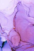 Abstract created using the technique of Alcohol ink. Macro photography of the smallest details of a panting. The panting shows how overflows of shades and colors of paint resemble space motifs. photo