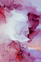 Abstract created using the technique of Alcohol ink. Macro photography of the smallest details of a panting. The panting shows how overflows of shades and colors of paint resemble space motifs. photo