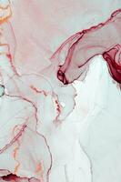 Abstract created using the technique of Alcohol ink. Macro photography of the smallest details of a panting. The panting shows how overflows of shades and colors of paint resemble space motifs. photo